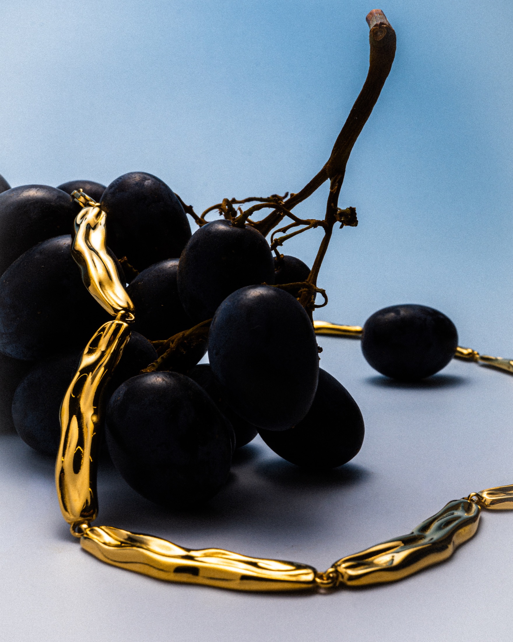 Mara Paris gold necklace styled with grapes