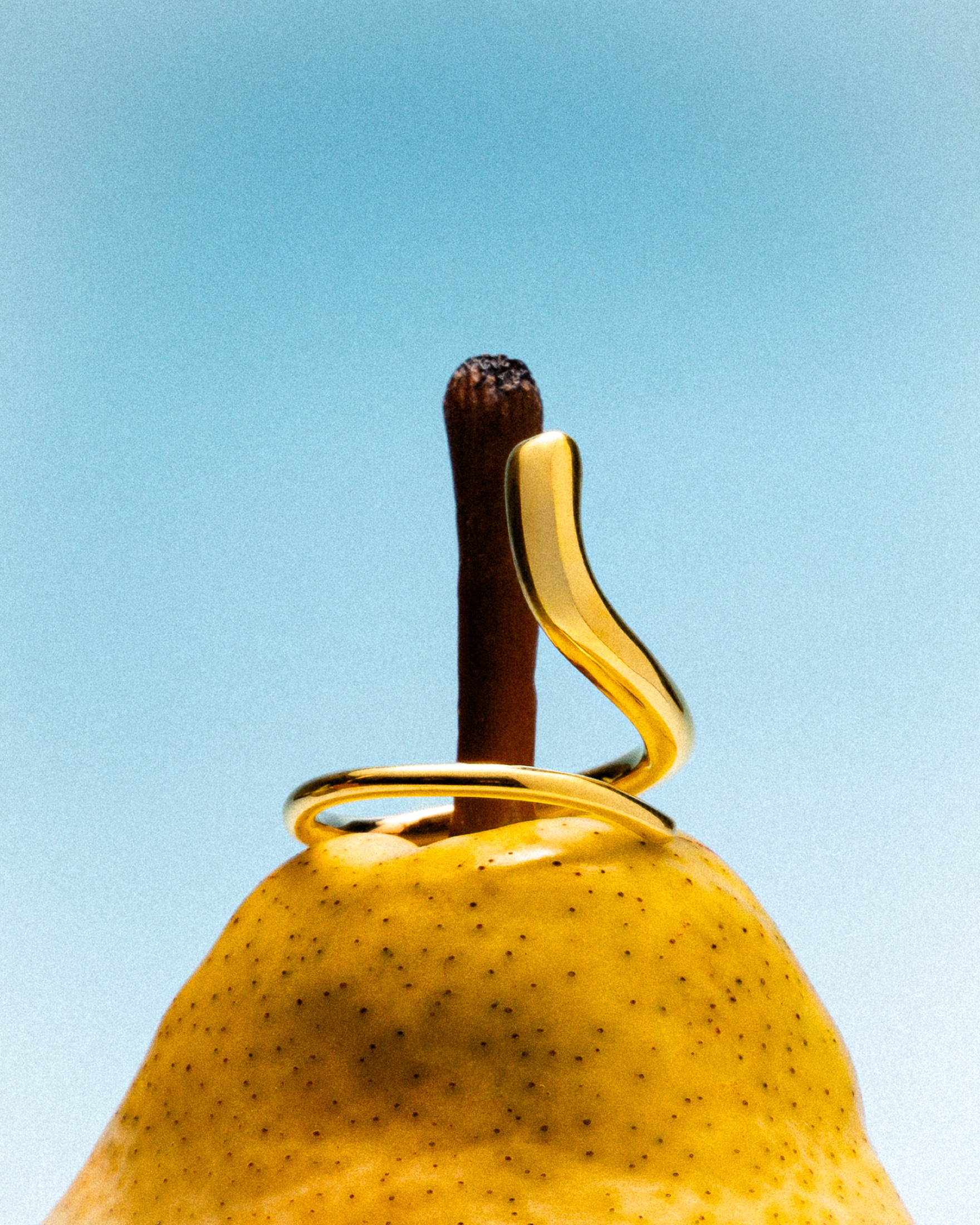 Mara Paris gold ring styled with a pear