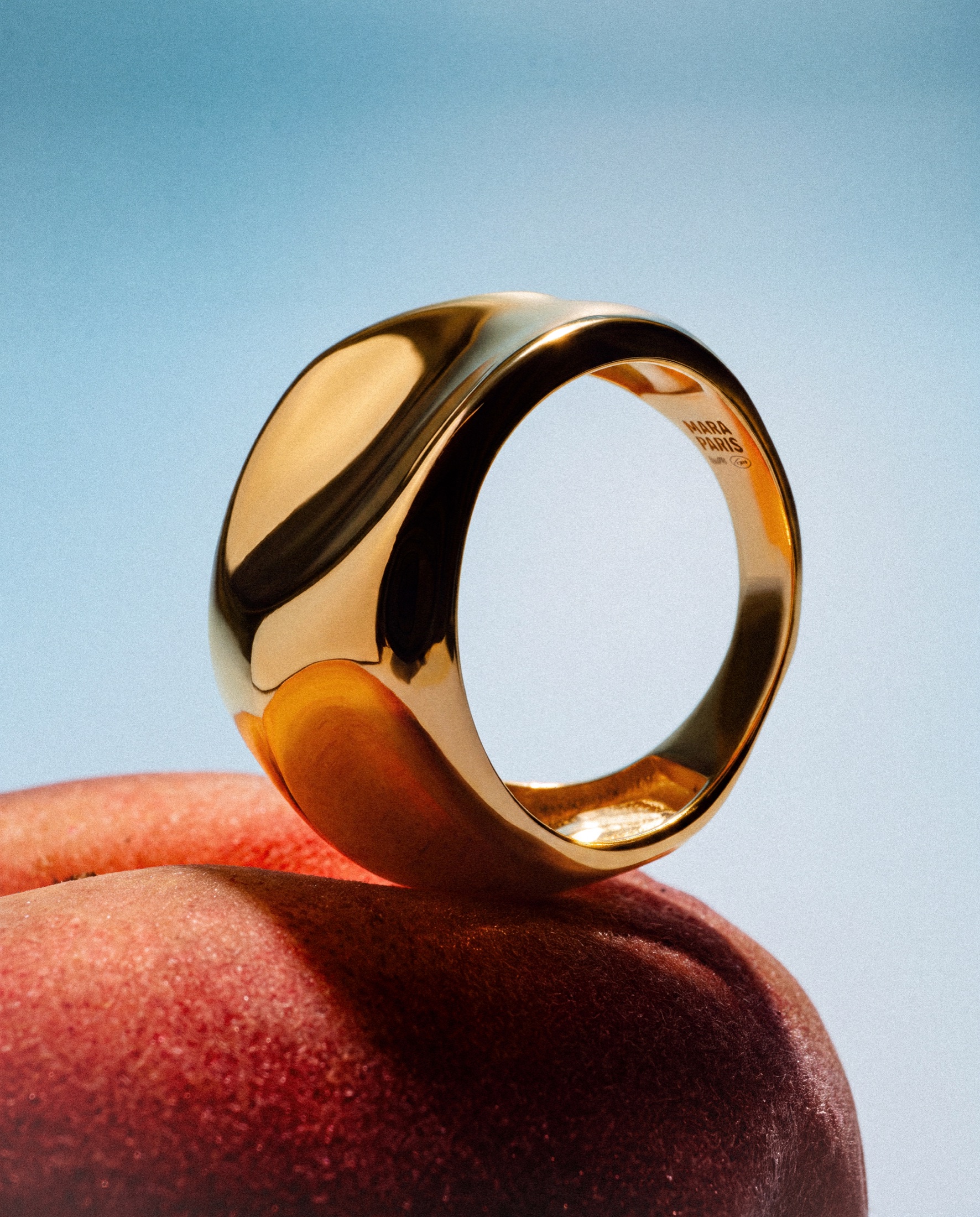 Mara Paris gold ring styled with fruit