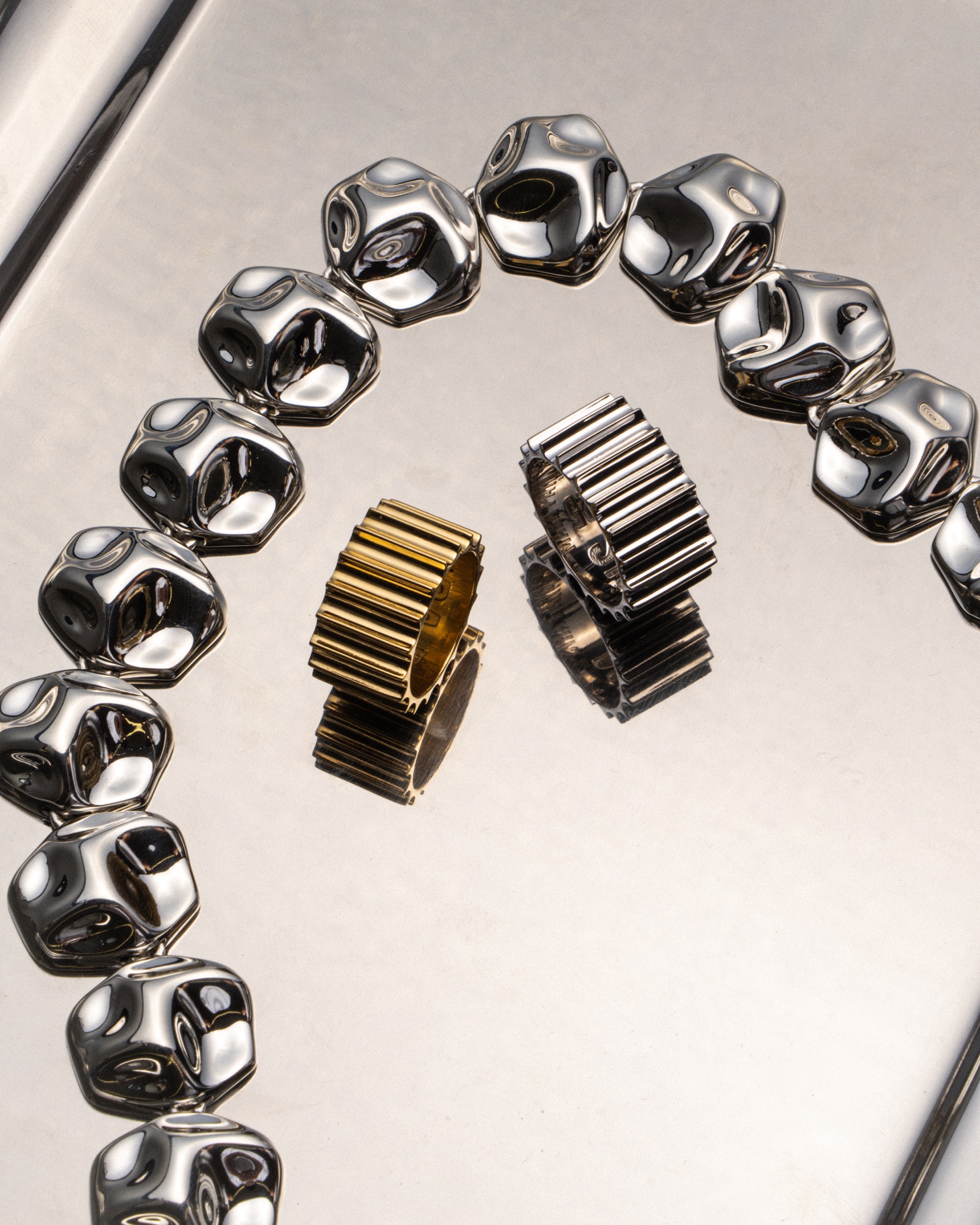Mara Paris rings and silver necklace still life