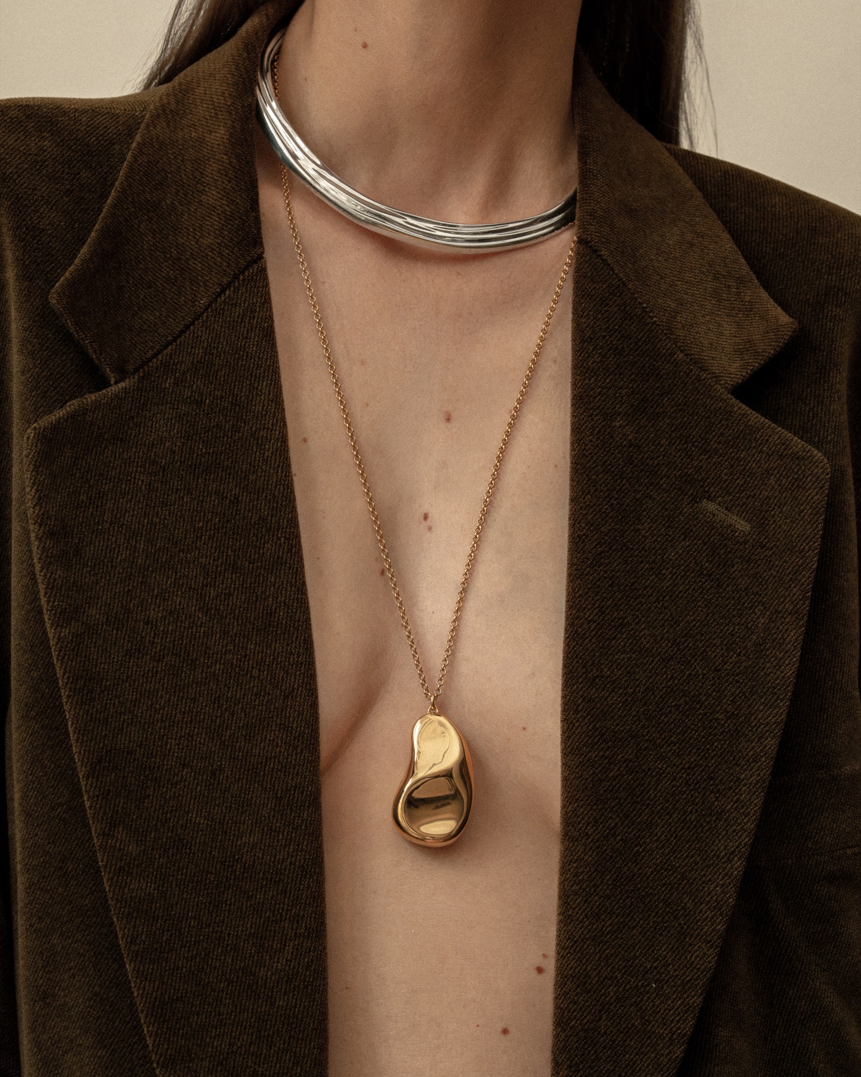 Mara Paris gold pendant and silver necklace portrait